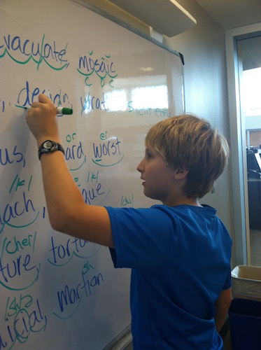 Student working at the whiteboard